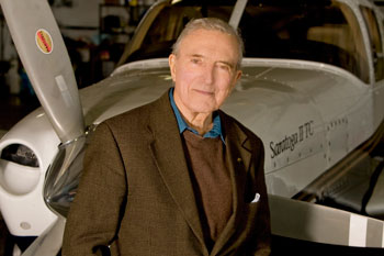 Howard Layton beside his plane